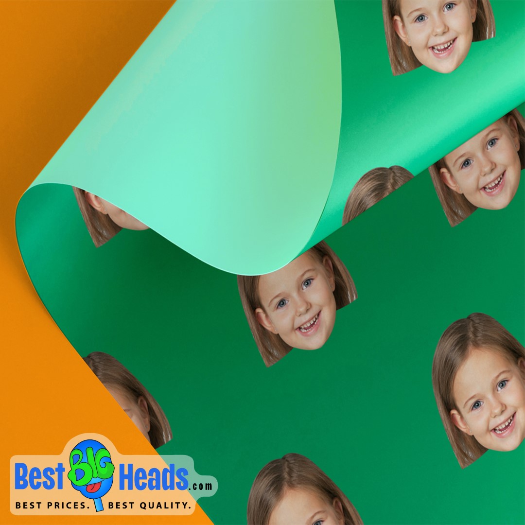 Custom gift wrap featuring a smiling young girl's face, printed on a green background and partially rolled up.